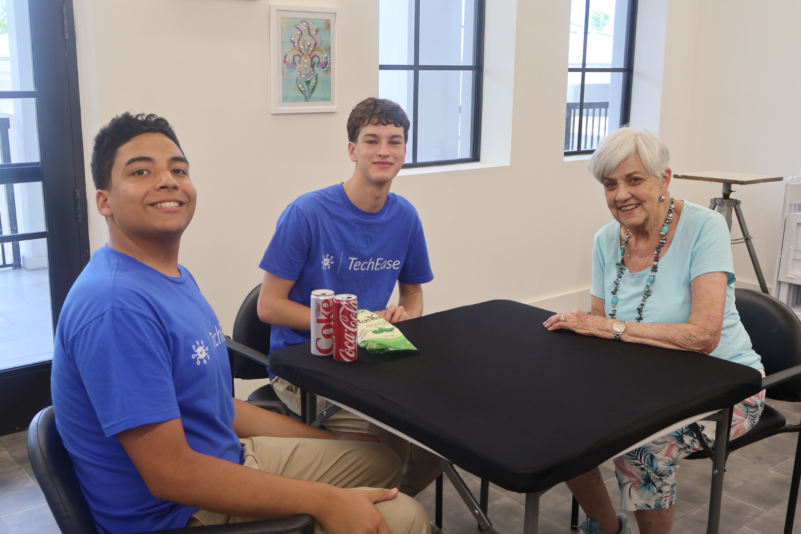 Volunteer helping senior with tablet
